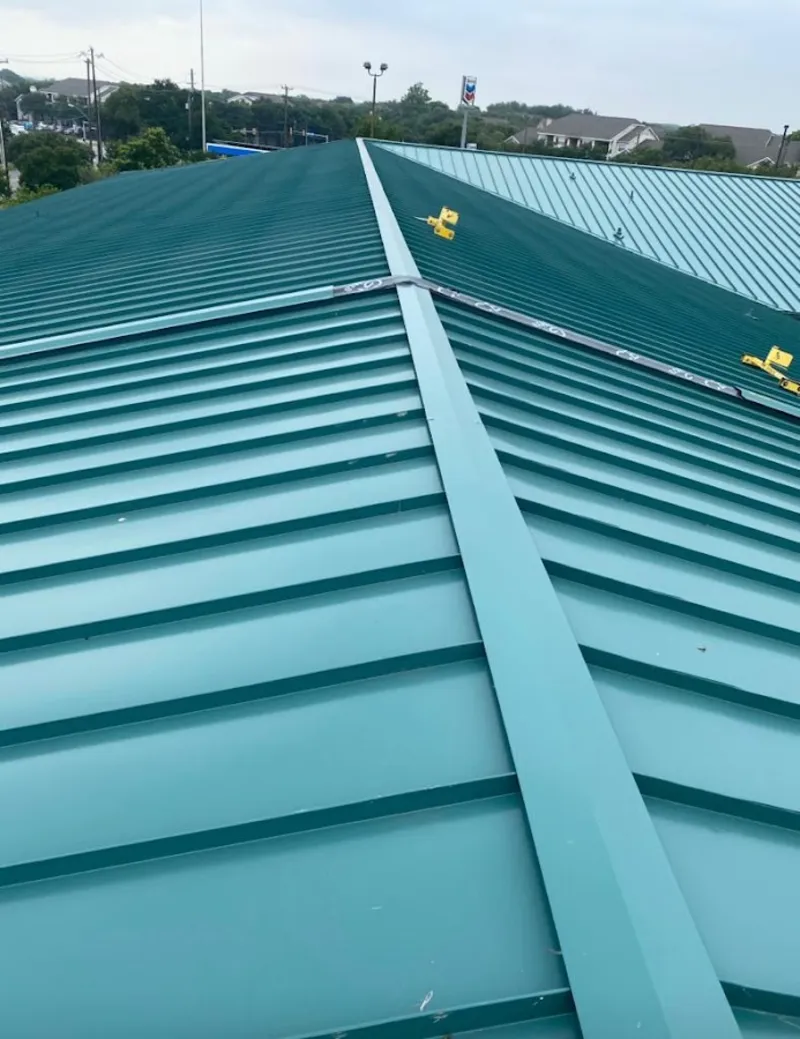 Green commercial metal roof ridge and valley for Metal Roof Repair in Paris